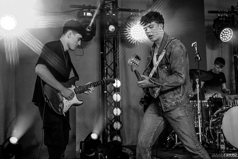 a crowd of people have their phones in their hands with the flashlight on and sing