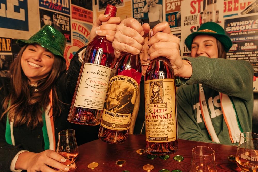 three bottles of pappy van winkle whiskey bottles on the bar at bub city