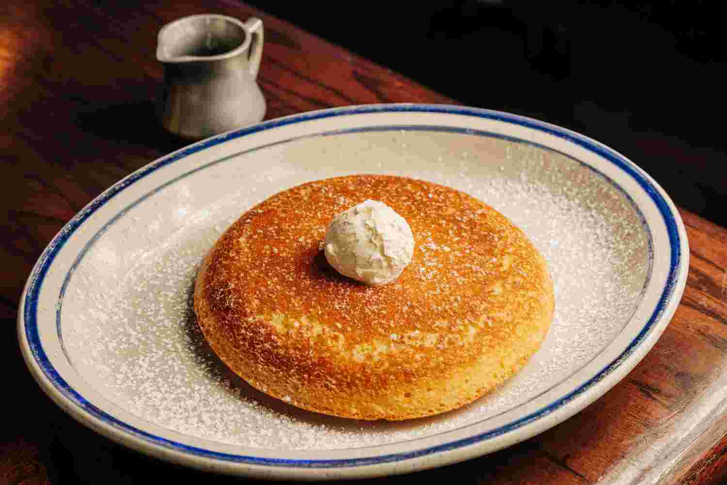 Golden Fluffy Pancake with a side of syrup