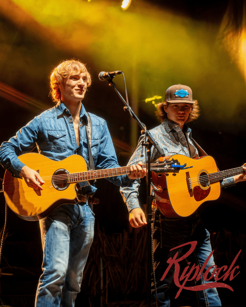 a crowd of people have their phones in their hands with the flashlight on and sing