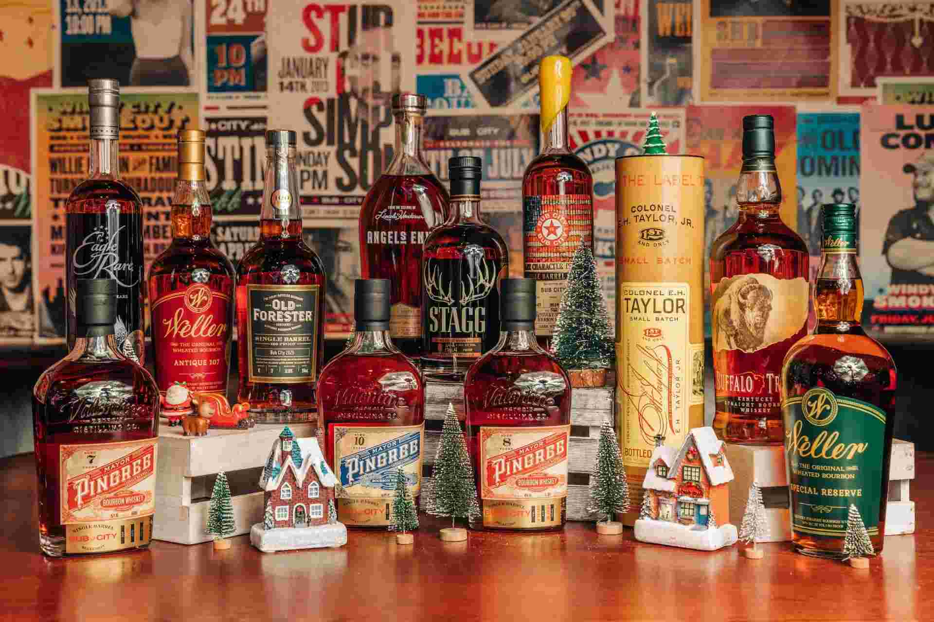 bottles of whiskey stacked together and christmas decor.