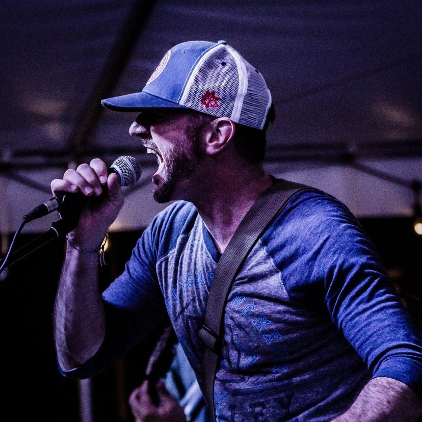 a crowd of people have their phones in their hands with the flashlight on and sing