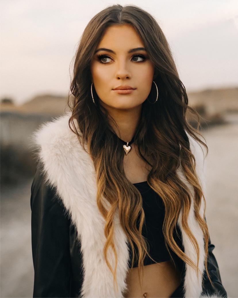 a crowd of people have their phones in their hands with the flashlight on and sing