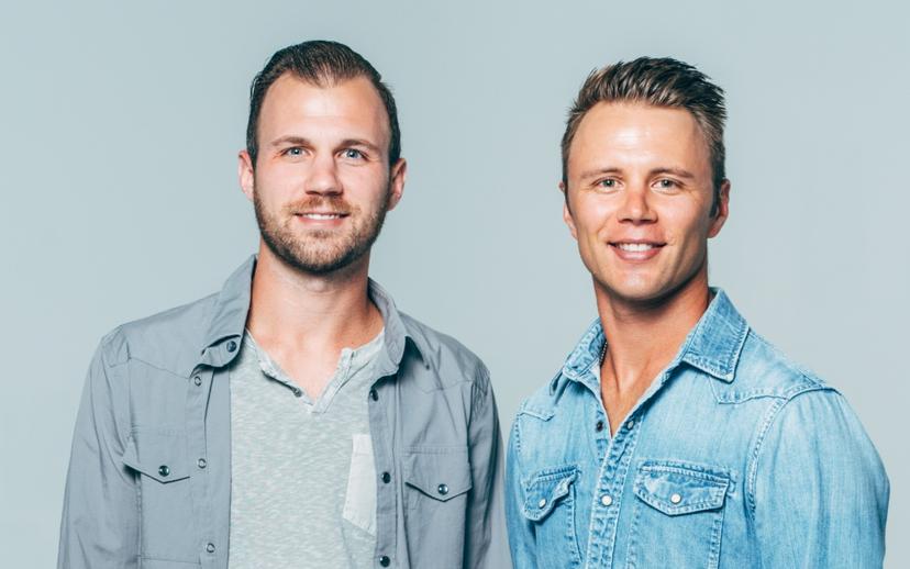 a crowd of people have their phones in their hands with the flashlight on and sing