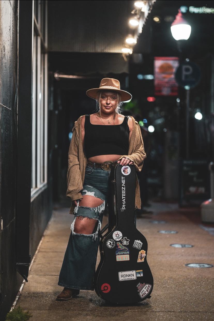 a crowd of people have their phones in their hands with the flashlight on and sing